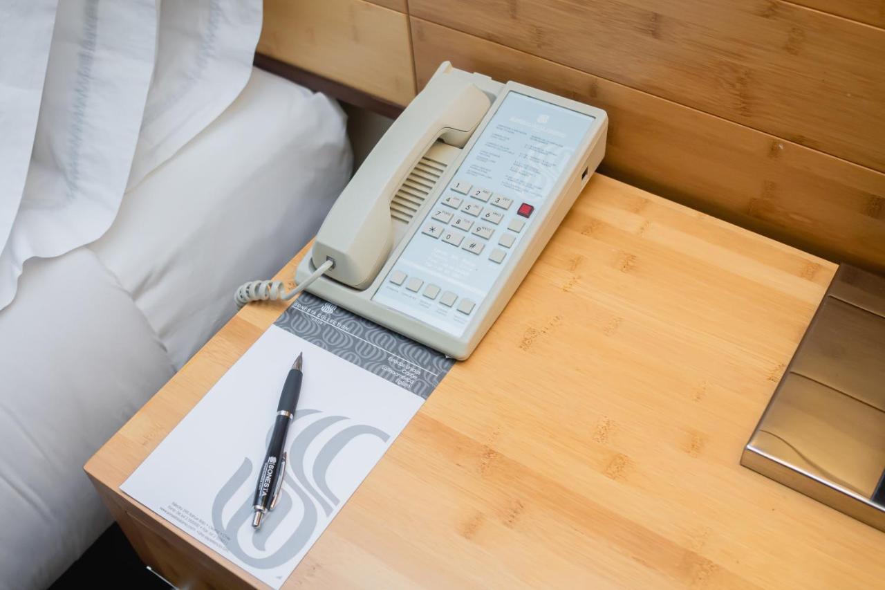 Sonesta Hotel Osorno Exterior photo A telephone in a hotel room