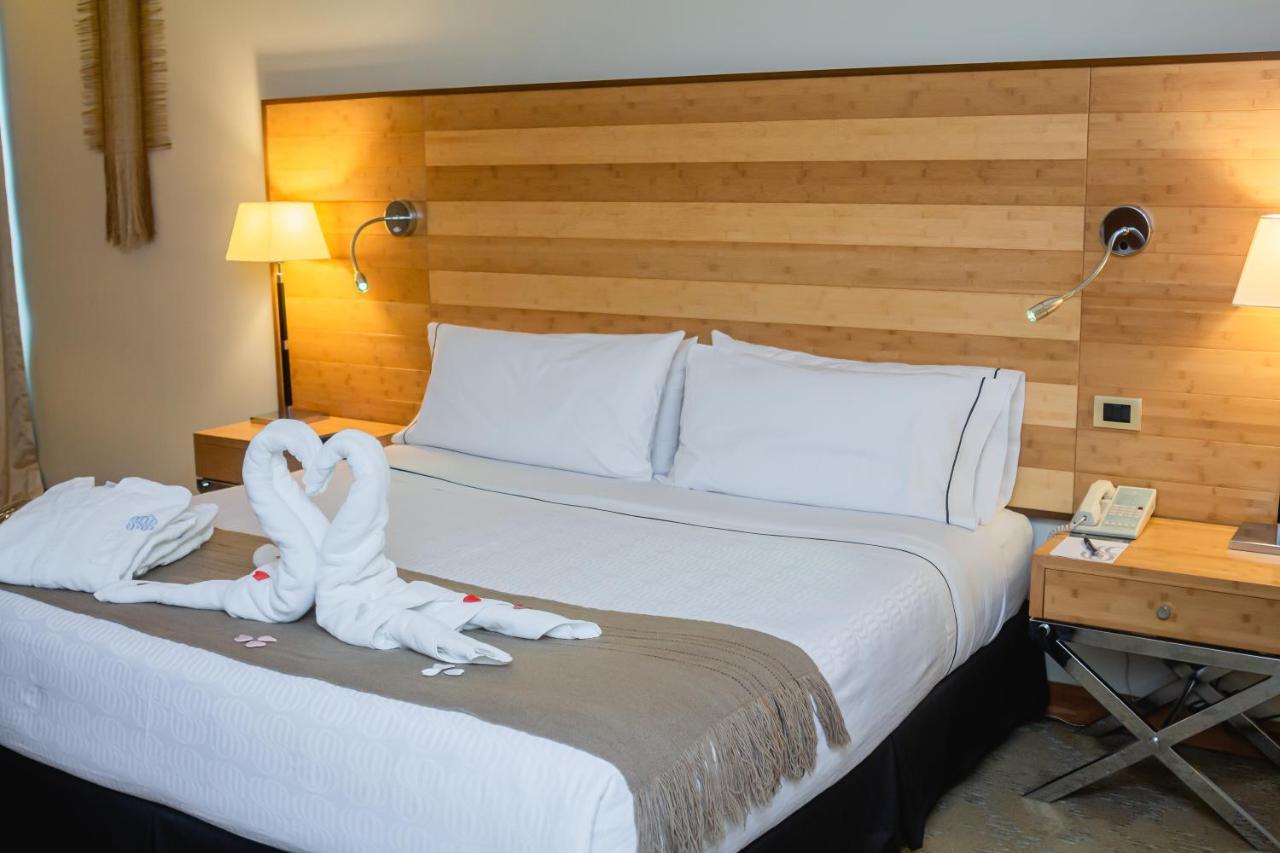 Sonesta Hotel Osorno Exterior photo A bed with a towel swan