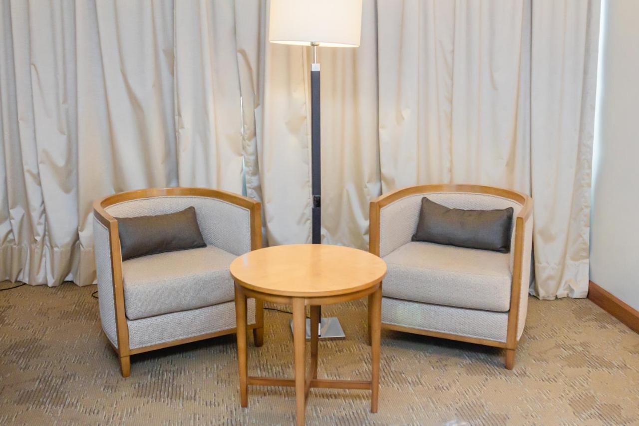 Sonesta Hotel Osorno Exterior photo A pair of club chairs