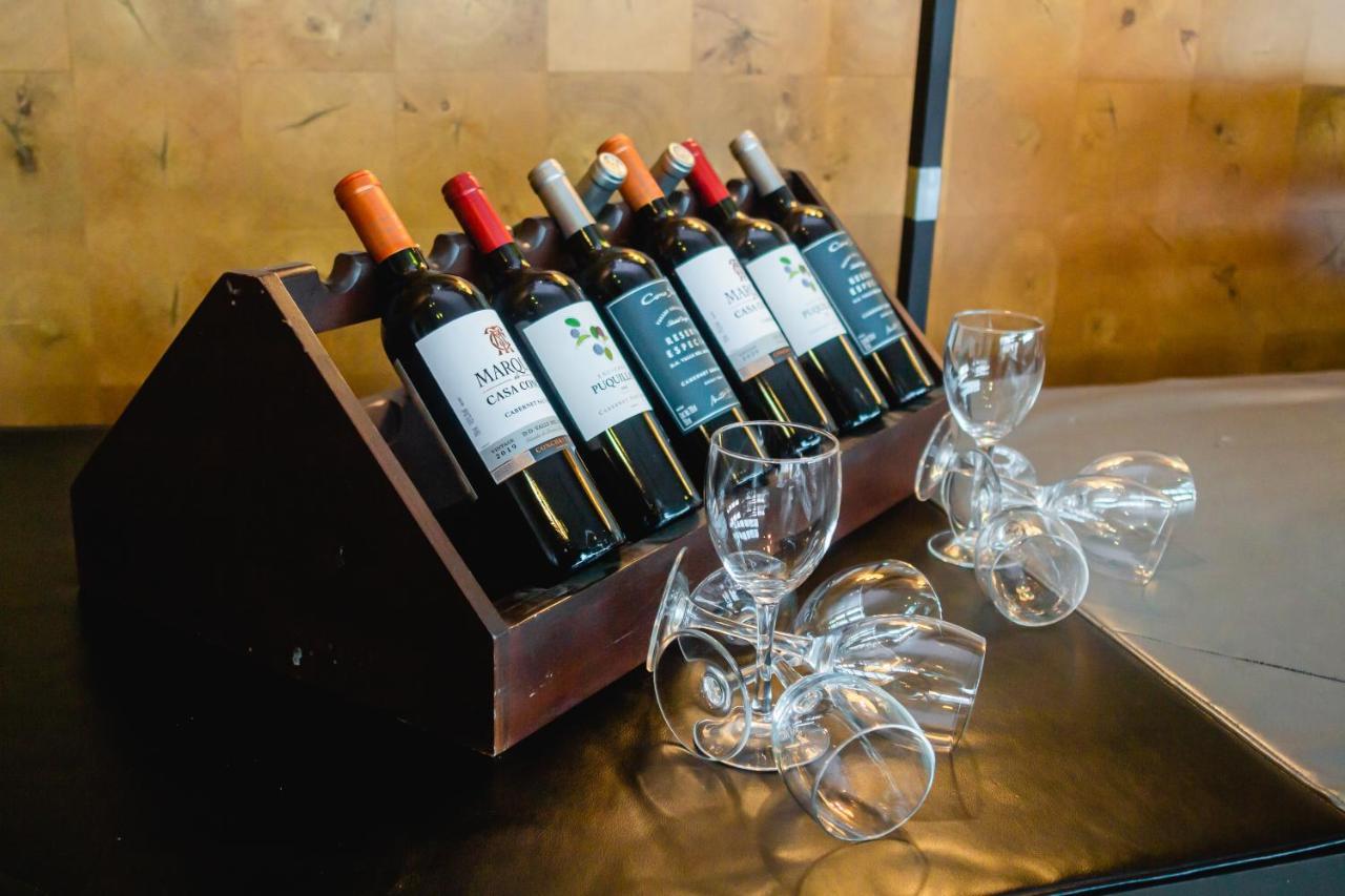 Sonesta Hotel Osorno Exterior photo Wine bottles at a wine tasting