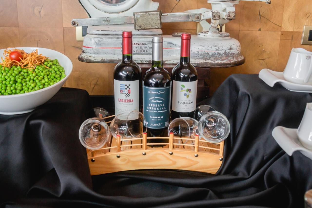 Sonesta Hotel Osorno Exterior photo Wine bottles and glasses